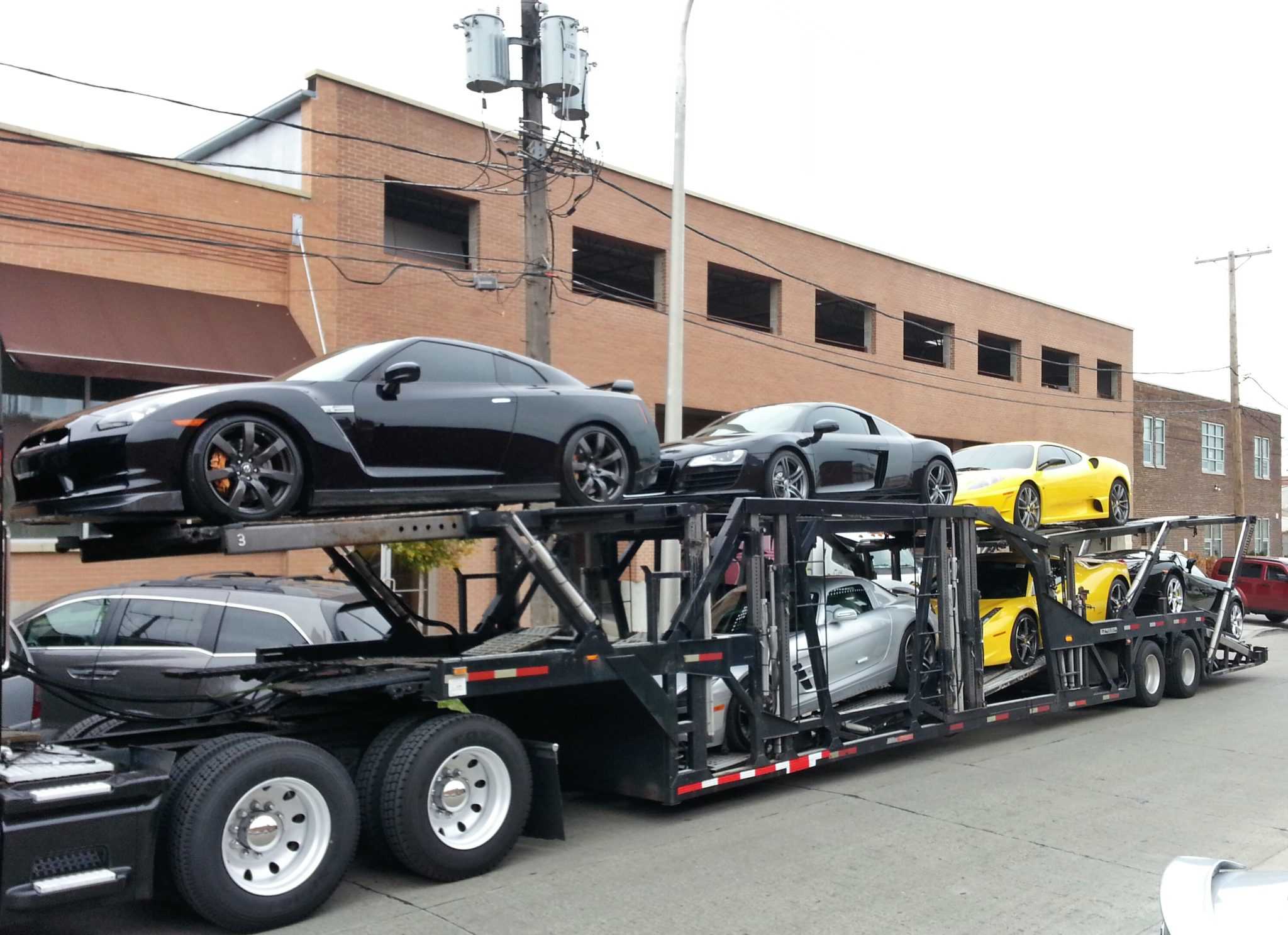 a truck load of exotic supercars holding over $1,000,000 worth of cars
