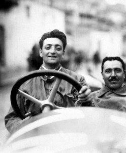 Photo Enzo Ferrari driving a race car when young