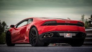 Photo of red rosso mars Lamborghini Huracán rear quarter