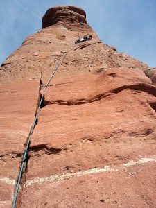 Photo of Tom rock climbing