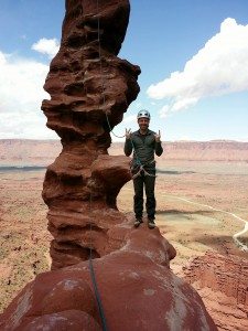 Photo of Tom at the top of a formed rock