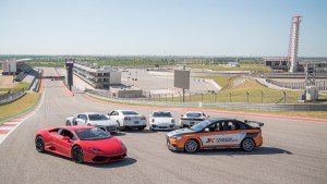 The fleet of supercars pose on the racetrack for a photo opportunity