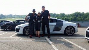 Image of xtreme xperience instructors at the track with an audi r8 and lamborghini gallardo