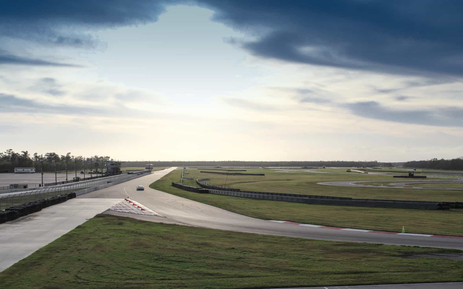 Image of Xtreme Xperience supercars on track at NOLA Motorsports Park