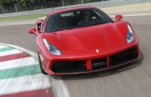 ferrari 488 gtb front view on track with curbing