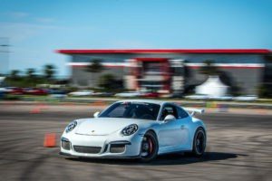 driving a porsche gt3 on a race track in new orleans