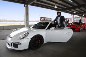 male participant in white porsche gt3 from dealer inspire event at nola with xteme xperience