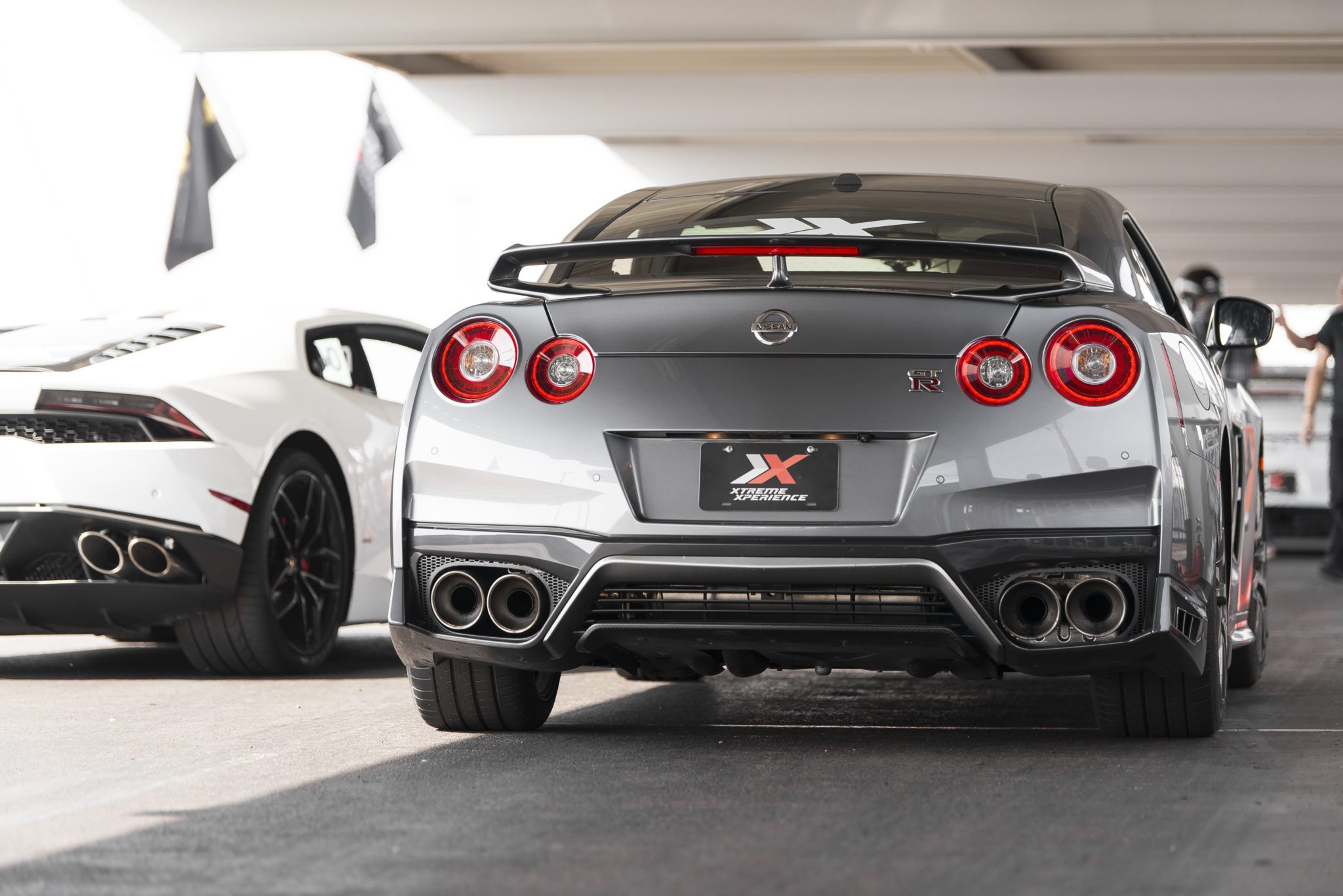 rear silver nissan gtr at track in pits