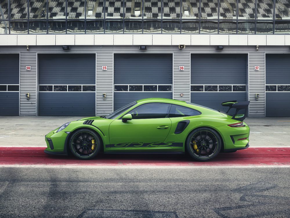 A side profile shot of a green Porsche GT3 RS.