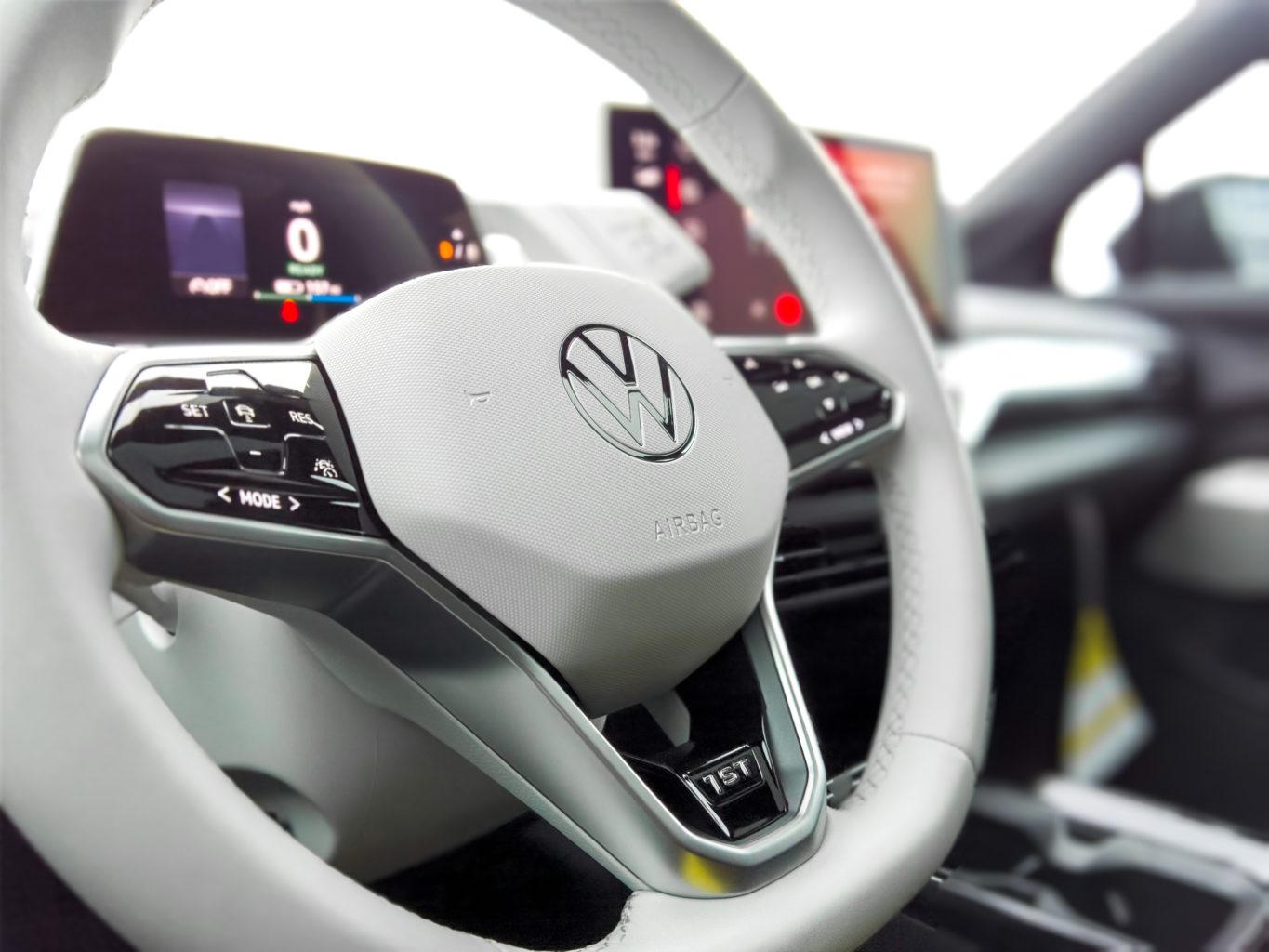 A picture of a Volkswagen steering wheel.