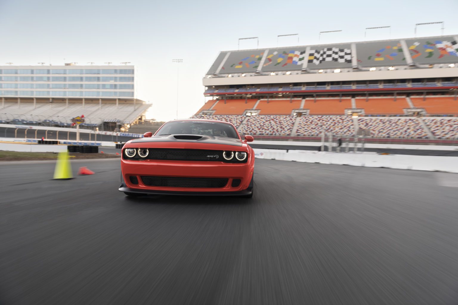 Dodge Challenger Hellcat from Xtreme Xperience driving on a racetrack.