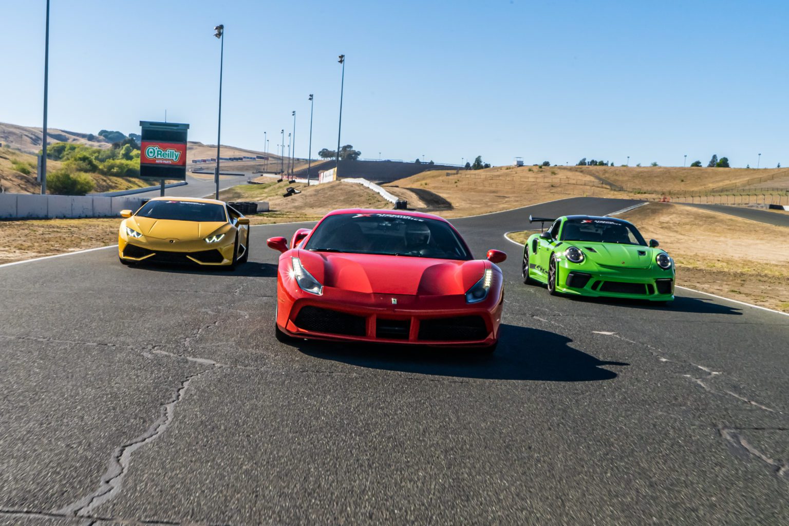 Xtreme Xperience's podium package driving on Sonoma Raceway's track